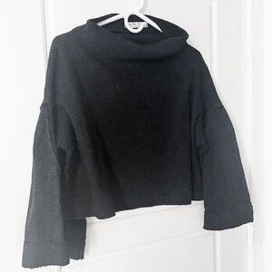 NWOT. Free People (We The Free). Black waffle sweater. Bat wing sleeves. Size XS